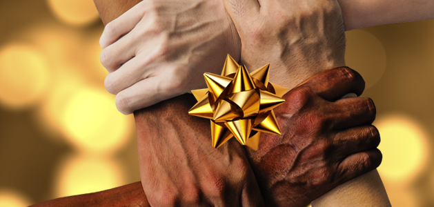 image of four hands clasped in the shape of a box